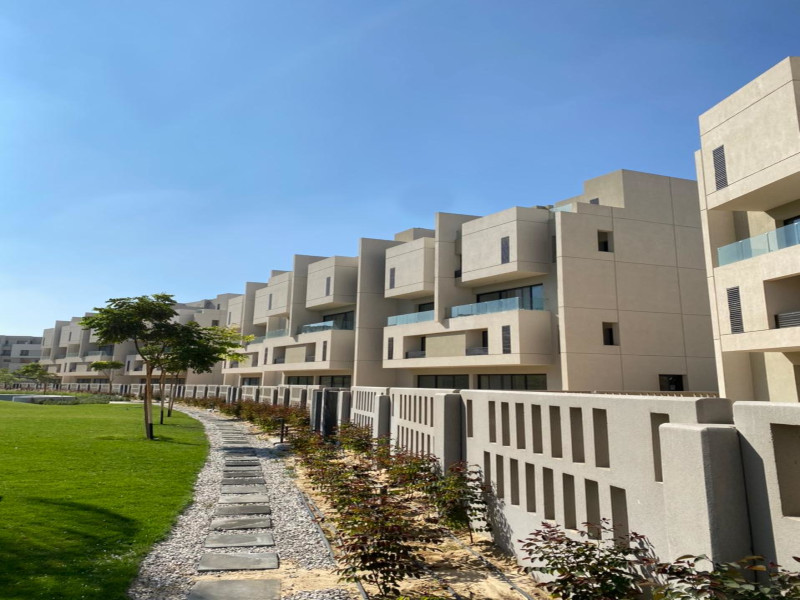 Townhouse overlooking landscape in burouj compound